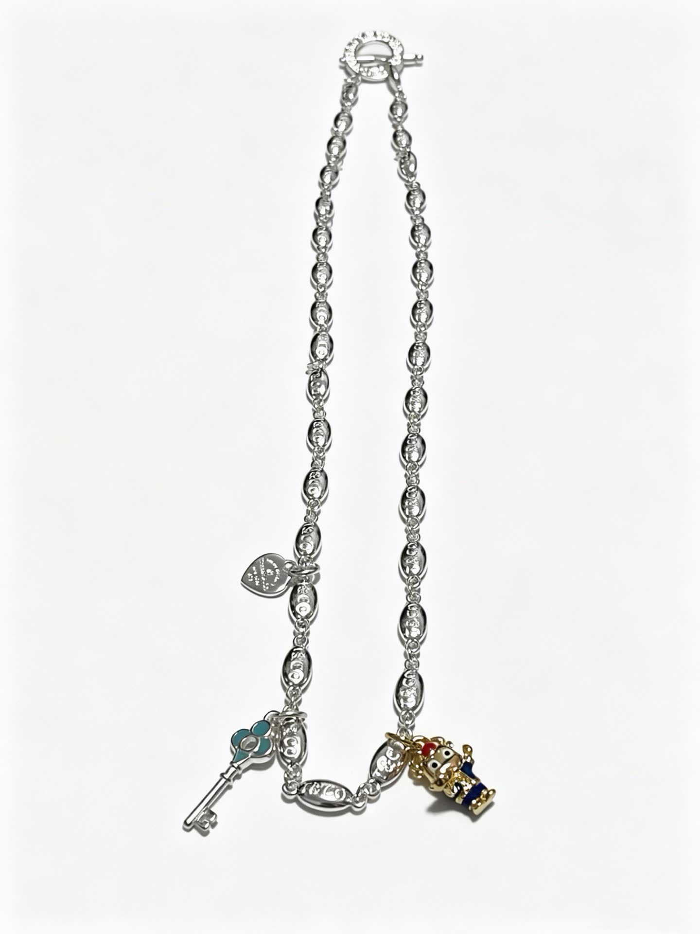 Tiffany & Co Silver Charm Bracelet with Key and Character Pendant
